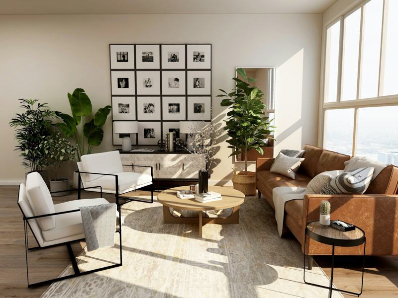 Bright living room with leather sofa, indoor plants and gallery wall