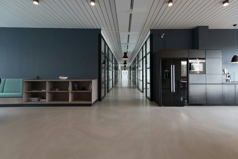 Open office with pantry and dark feature wall