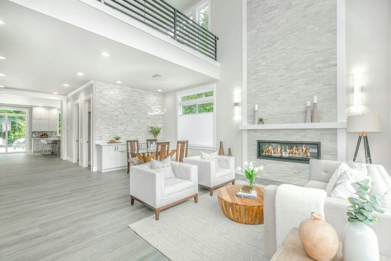 Double-height villa living room with fireplace